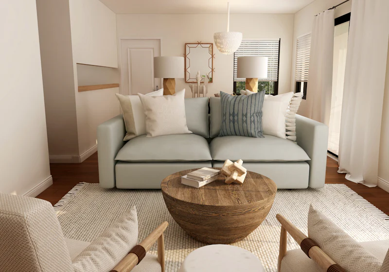Helles Wohnzimmer mit Sofa und rundem Holztisch